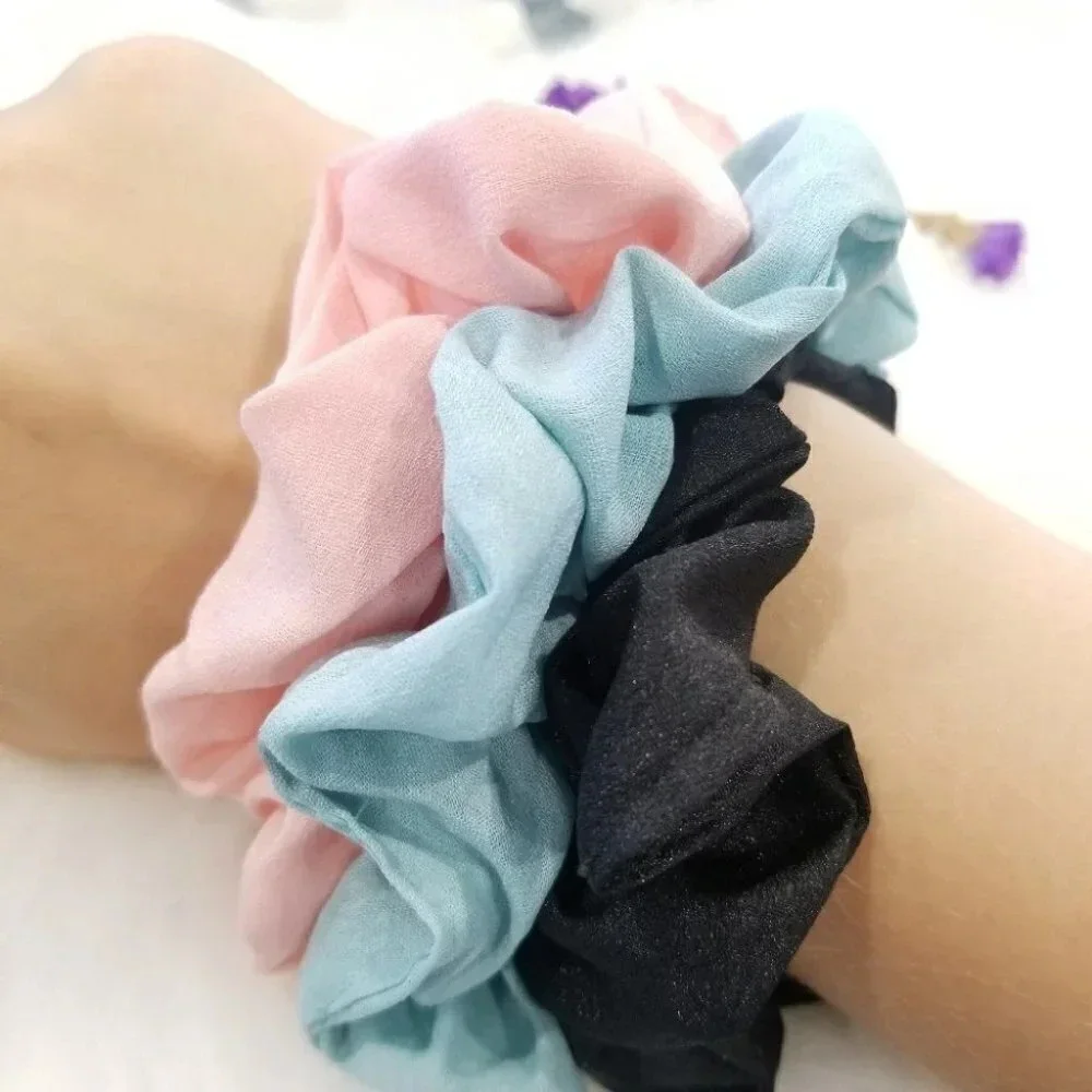 Pink, blue and black scrunchies